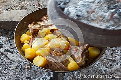 Lamb with potato in SaÄ sach, traditional metal cookware Stock Photo